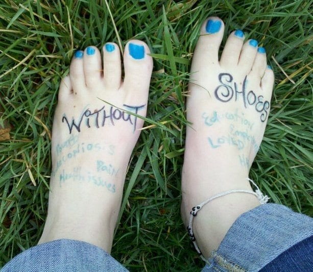 Image of feet with writing on them for TOMS one day without shoes