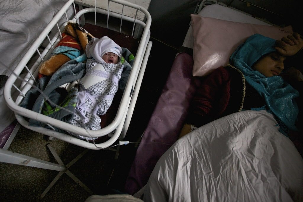 A new born baby and mother in the Istiqlal Hospital, Kabul