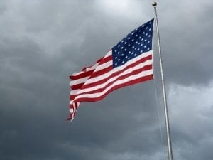 Flag Against Storm Clouds by Moniquef12