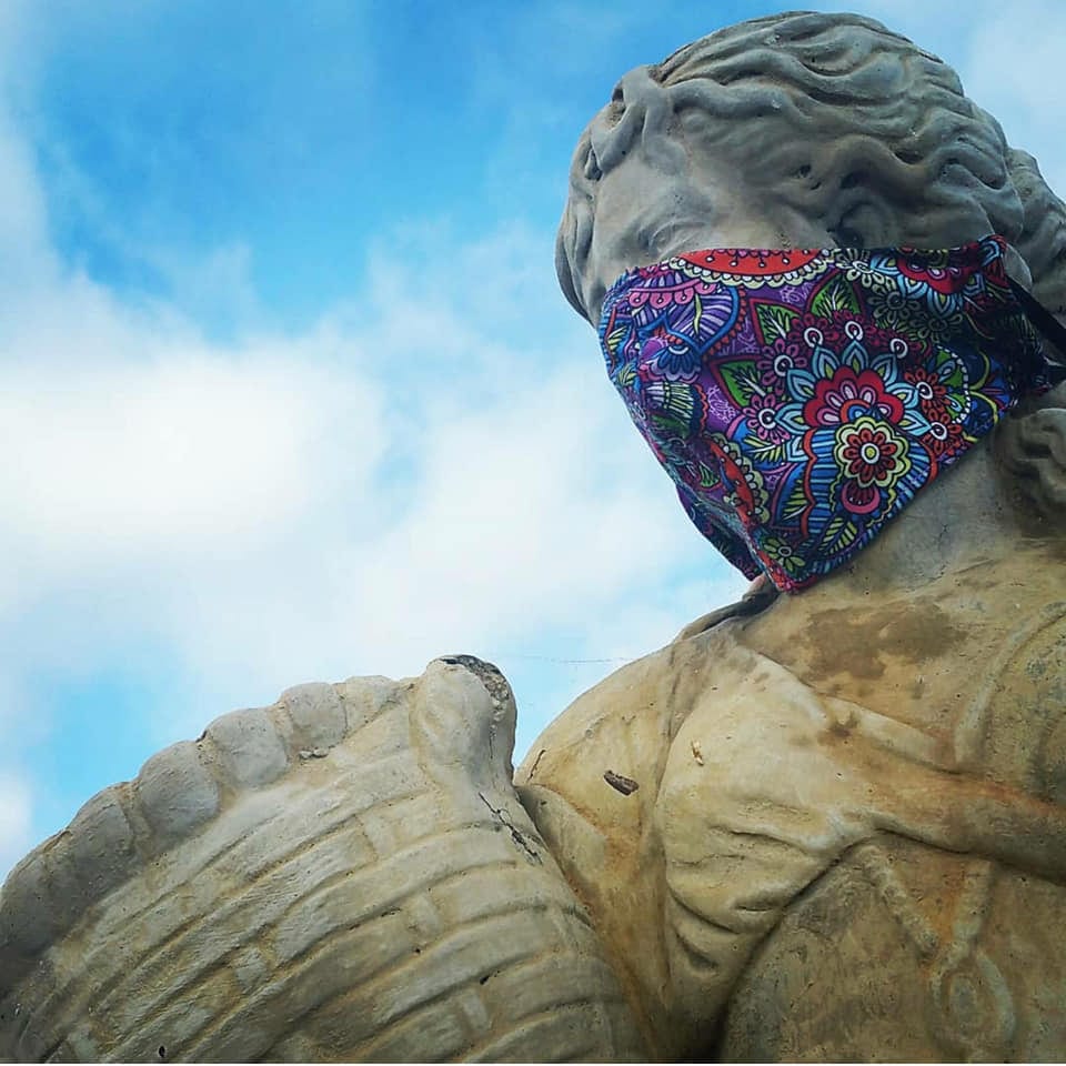 Blue sky and mask and statue