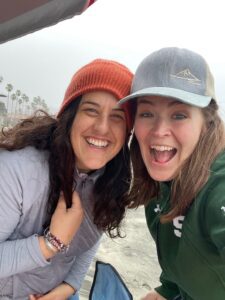 Elisa Johnston and cousin at the beach in San Diego in the rain