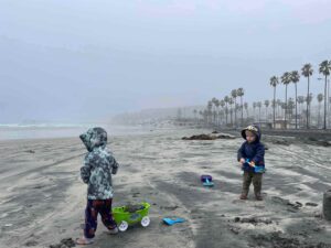 Elisa Johnston and family at San Diego Beach in the Rain 2024