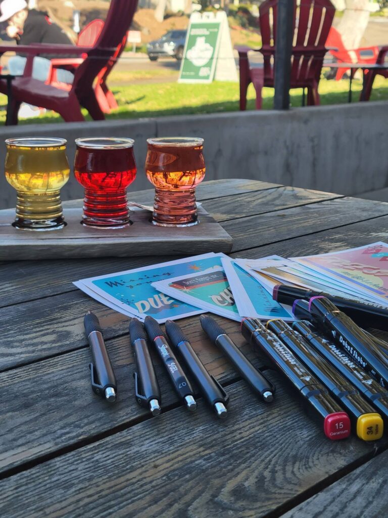 Political Postcard Party using our voice in San Diego Newtopia Cider